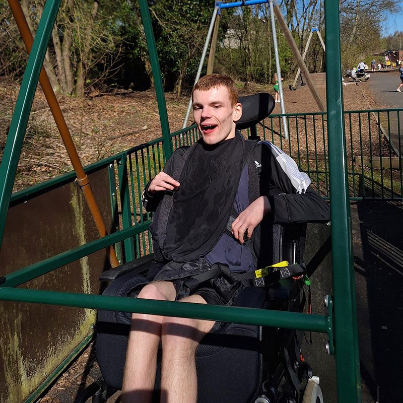 Caleb having fun on swing